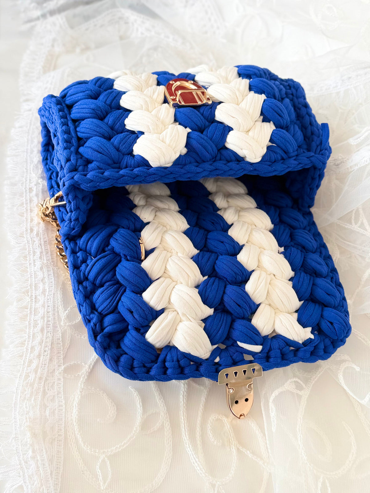 Blue handwoven mini bag with silver chain strap