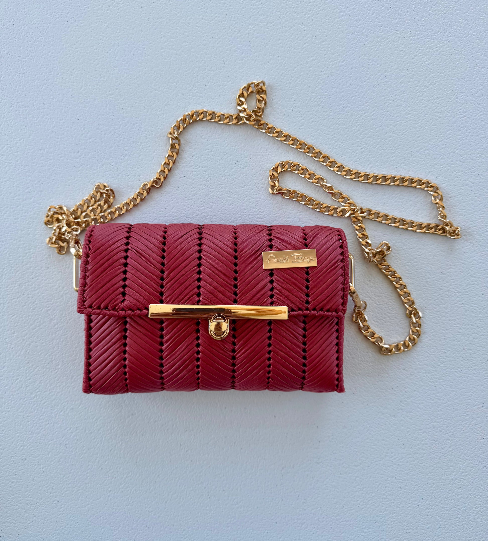 Red handwoven mini clutch with gold chain strap