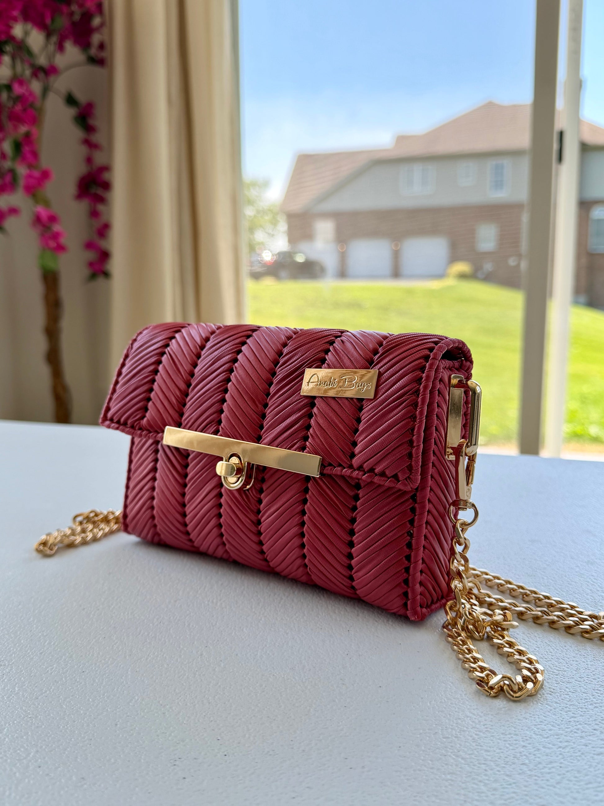 Red handwoven mini clutch with gold chain strap