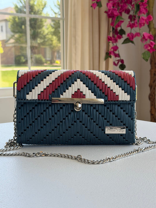 Handwoven crossbody bag with silver chain strap
