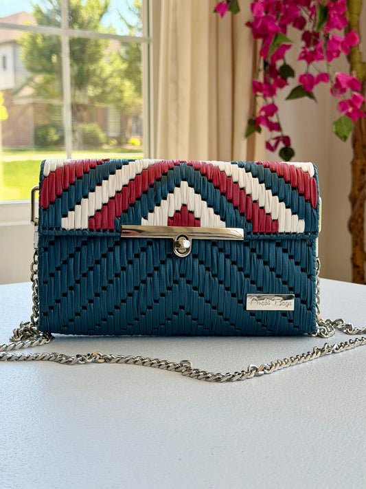Handwoven crossbody bag with silver chain strap