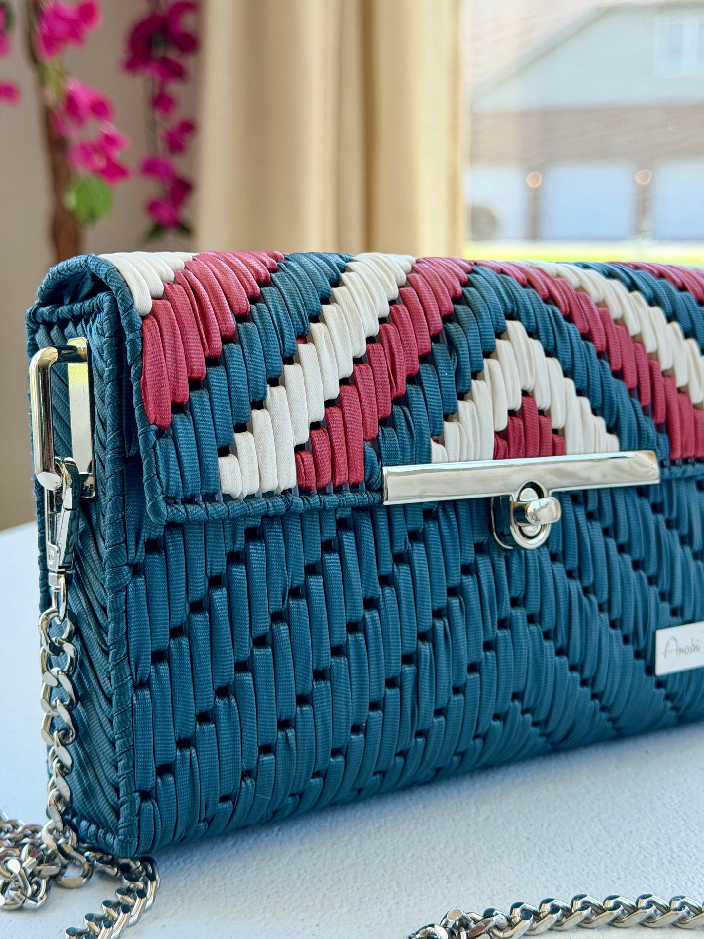 Handwoven crossbody bag with silver chain strap