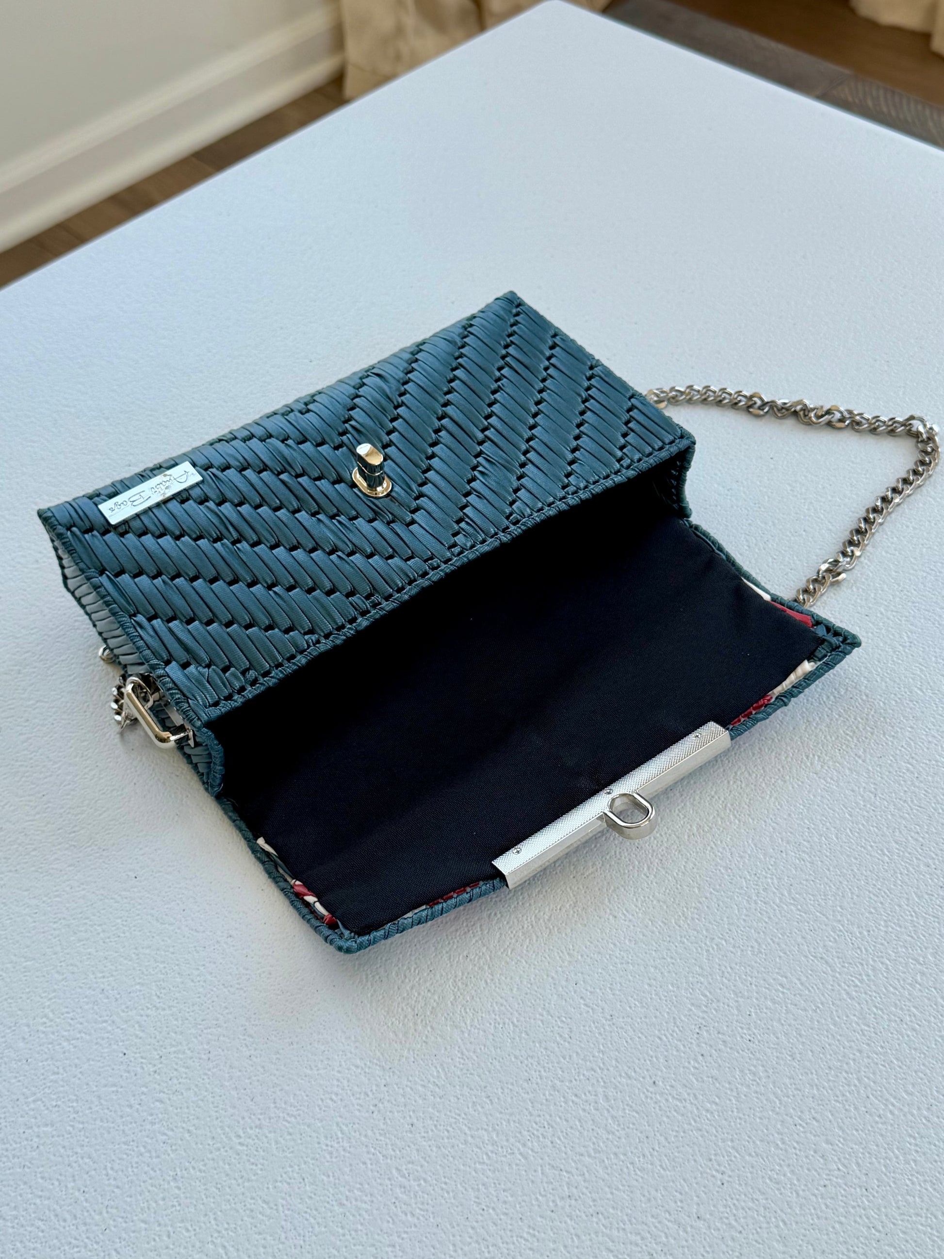 Handwoven crossbody bag with silver chain strap