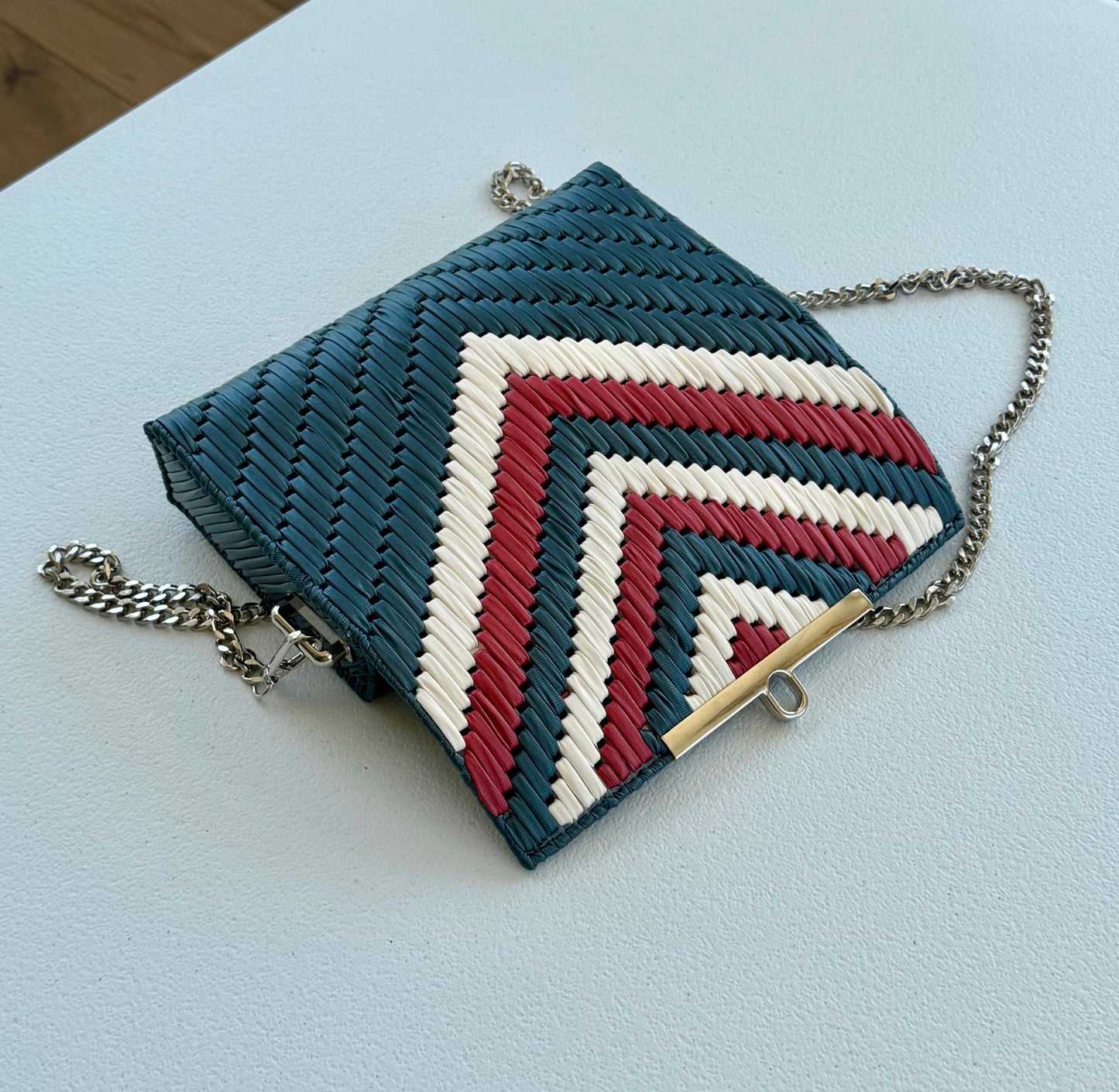 Handwoven crossbody bag with silver chain strap